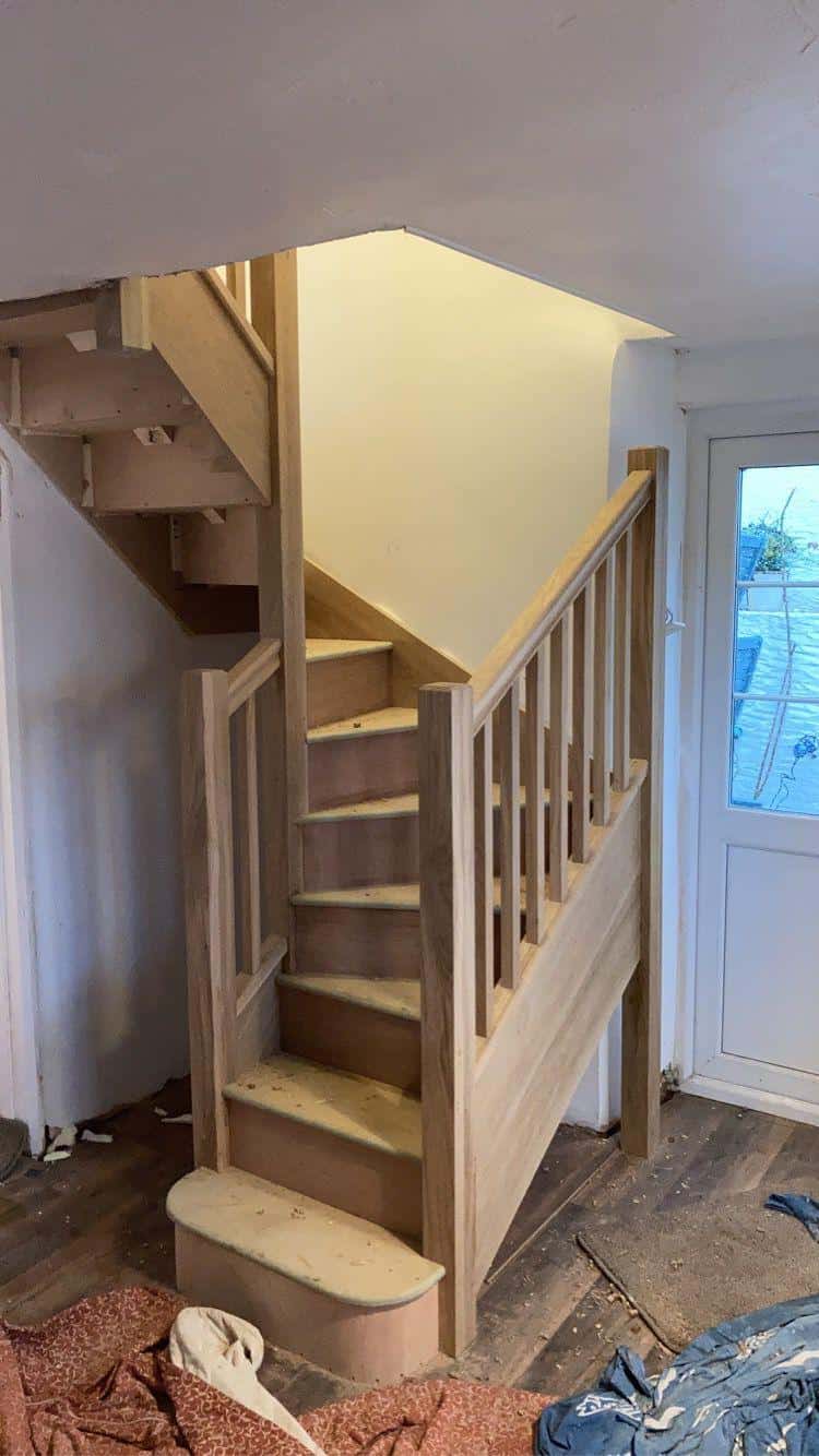 Natural wooden staircase construction by JB Carpentry & Construction.