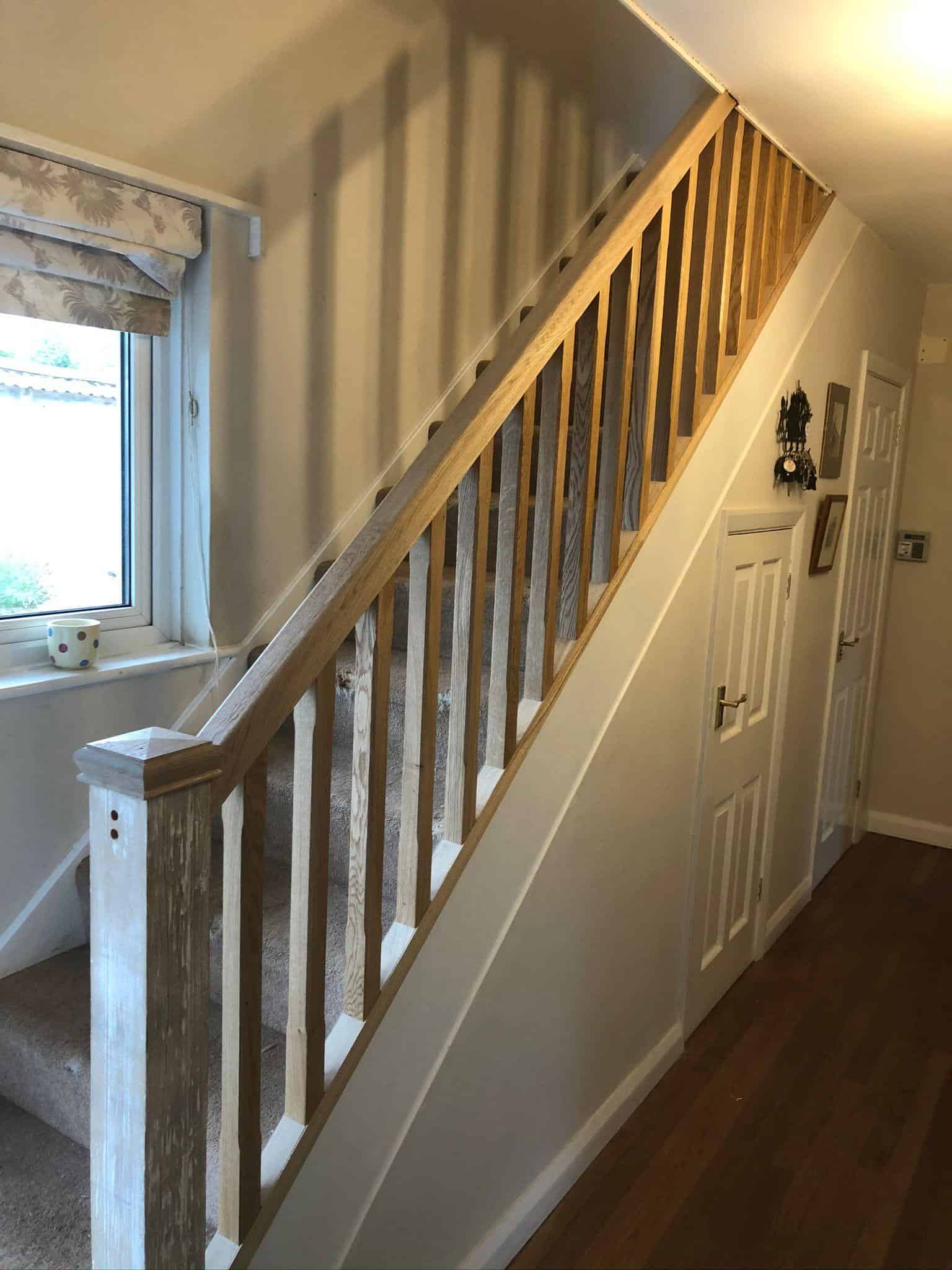 Natural wood staircase handrail and balustrade for stylish indoor carpentry and construction.