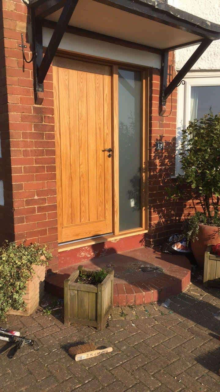 New wooden front door installation by JB Carpentry & Construction, expert in carpentry and building services.