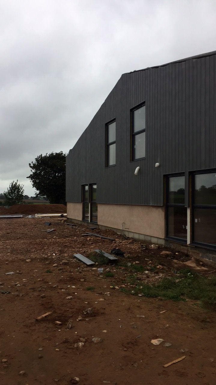 Modern black exterior cladding on new JB Carpentry & Construction building.