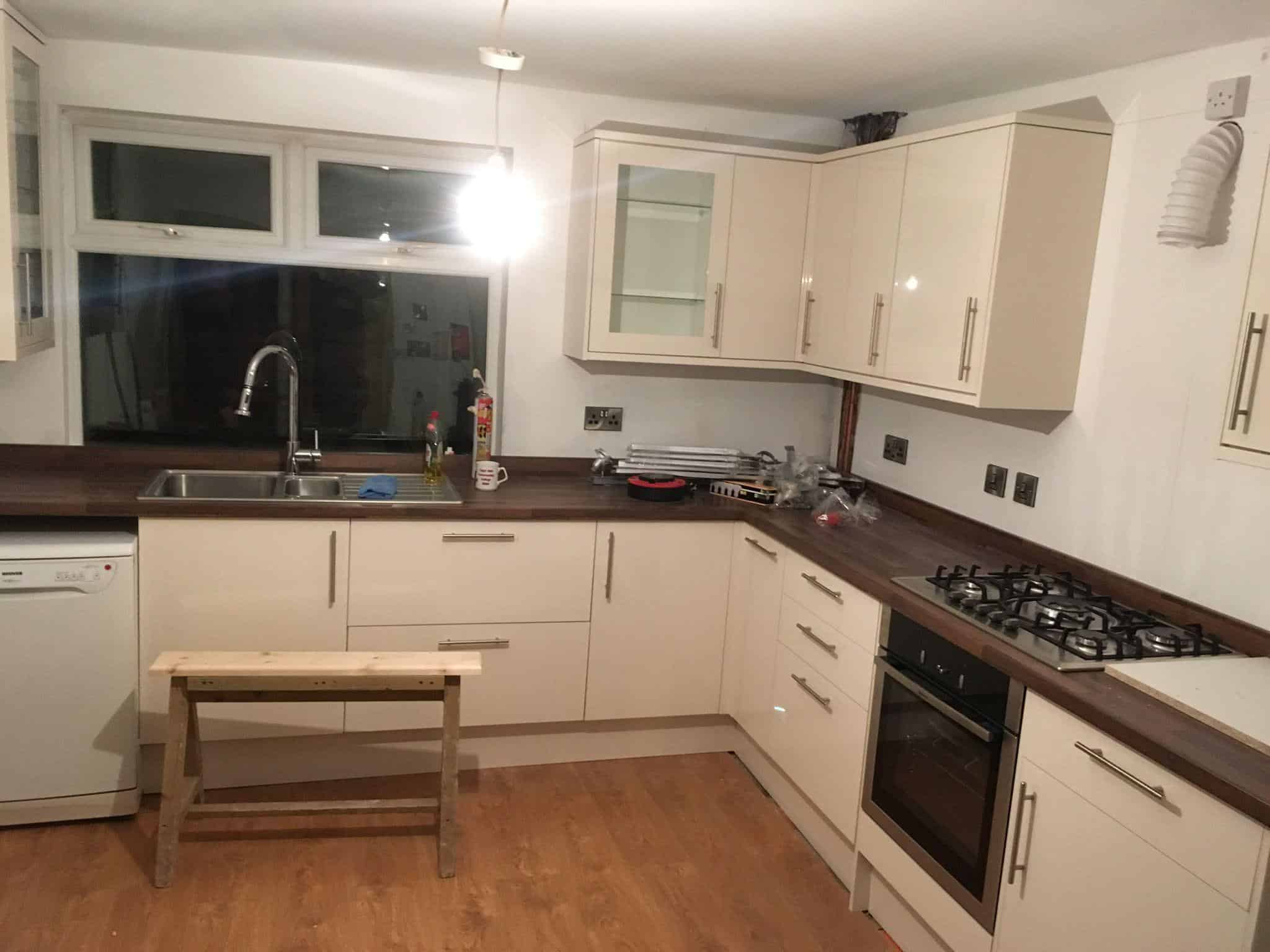 Modern kitchen renovation by JB Carpentry & Construction in the UK, featuring fitted cabinets and a gas stove.