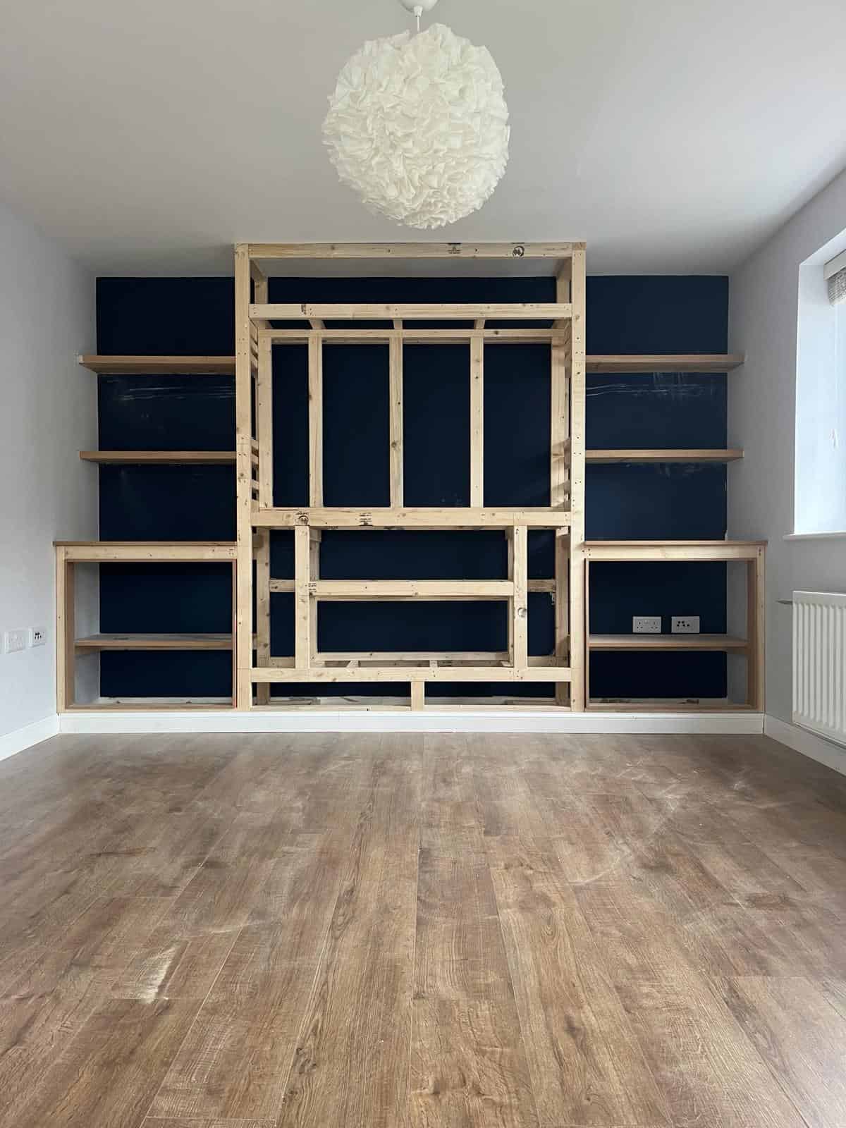 Built-in wooden shelving unit for home storage and organisation by JB Carpentry & Construction.