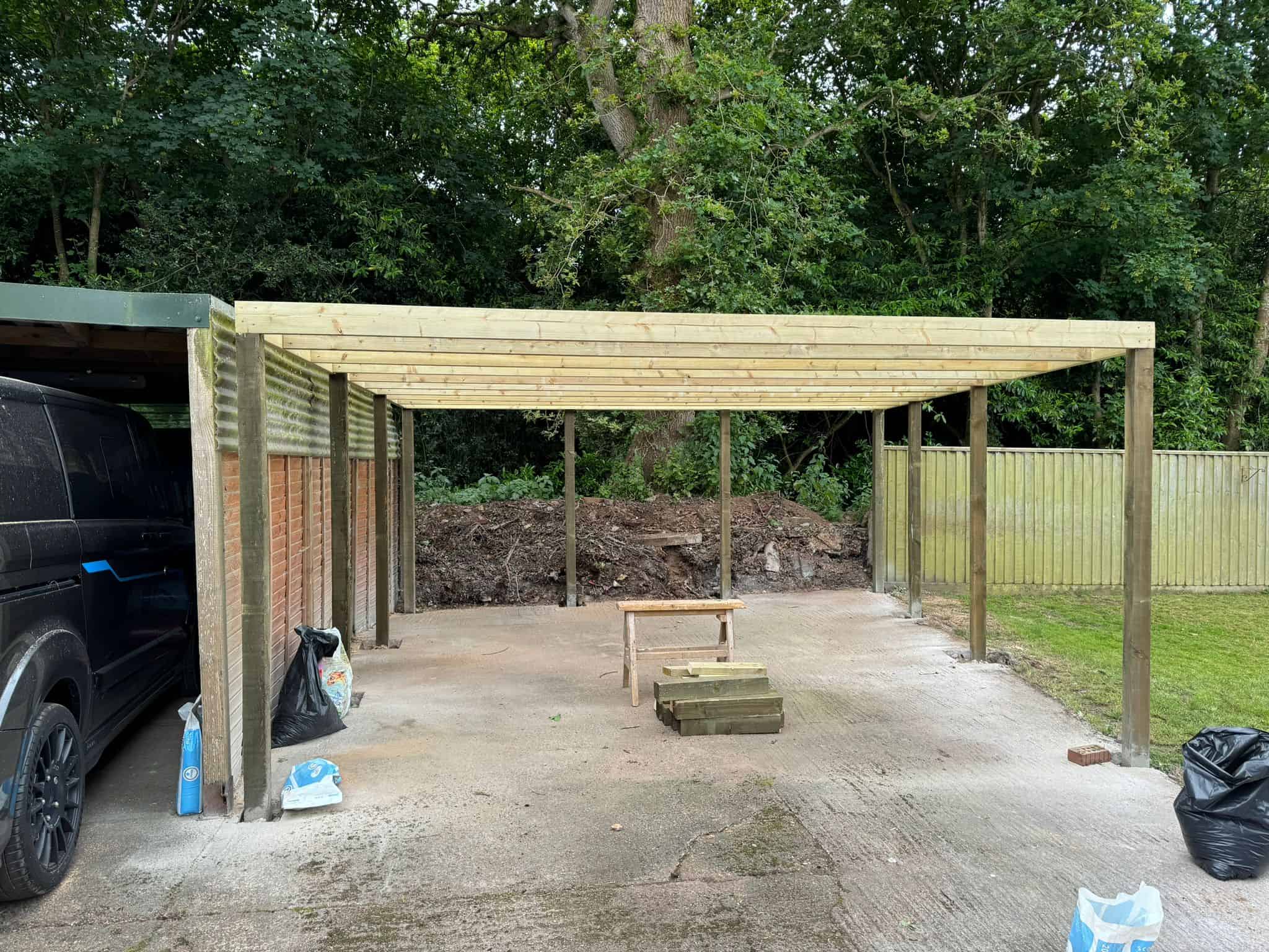 Timber carport construction for garden storage by JB Carpentry & Construction. Skilled carpentry services in the UK.