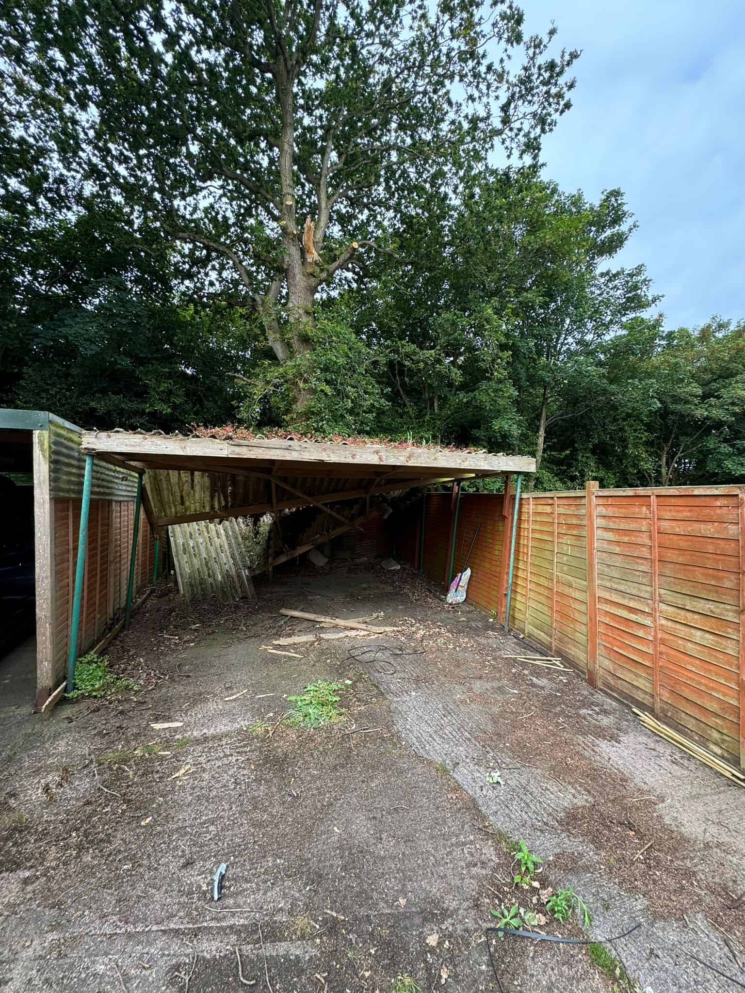 Tear-down of old carport to build new wooden garage by JB Carpentry & Construction. Expert carpentry and construction services in the UK.