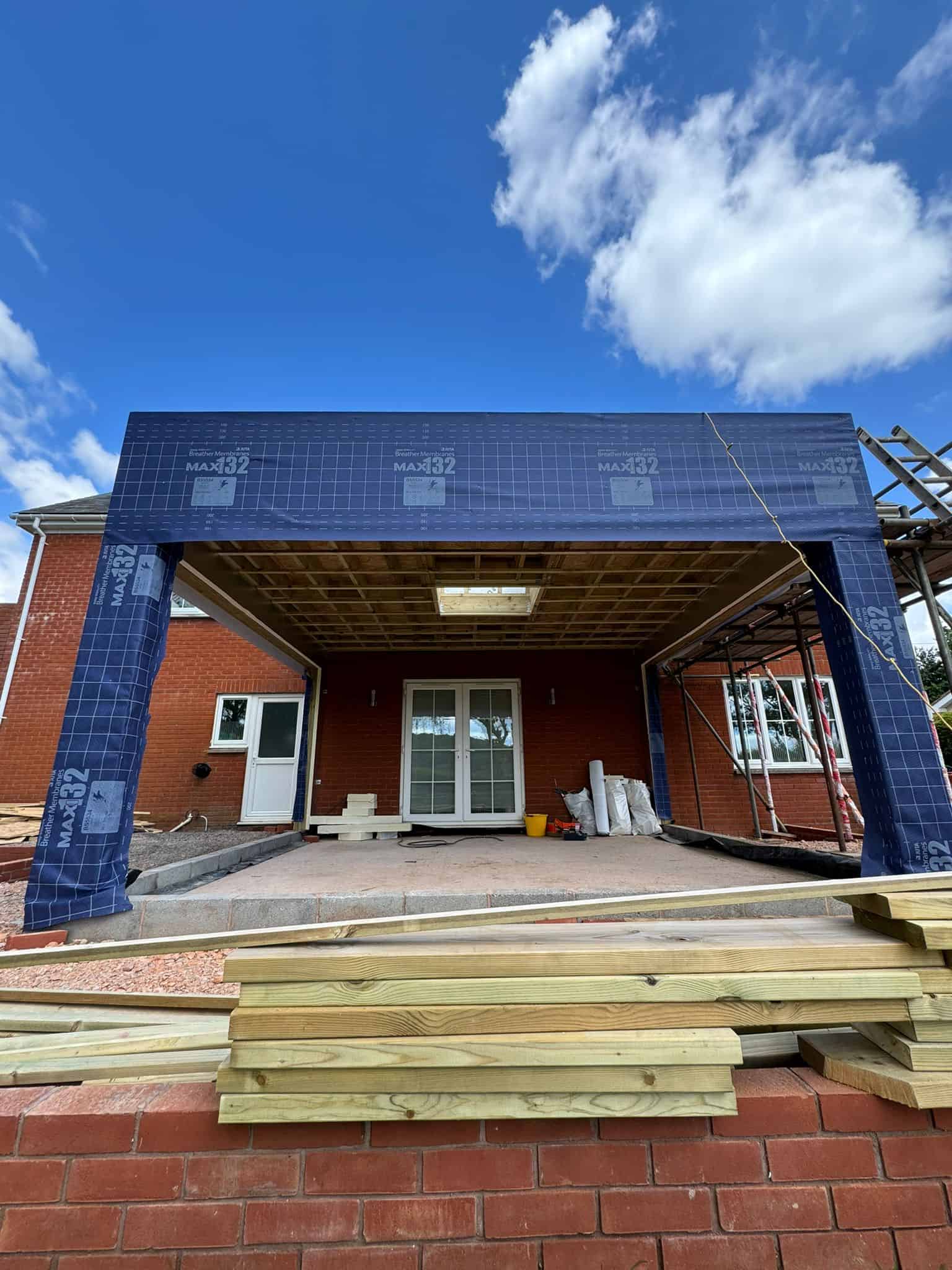 Modern residential extension under construction by JB Carpentry & Construction, featuring quality timber framing and roofing.
