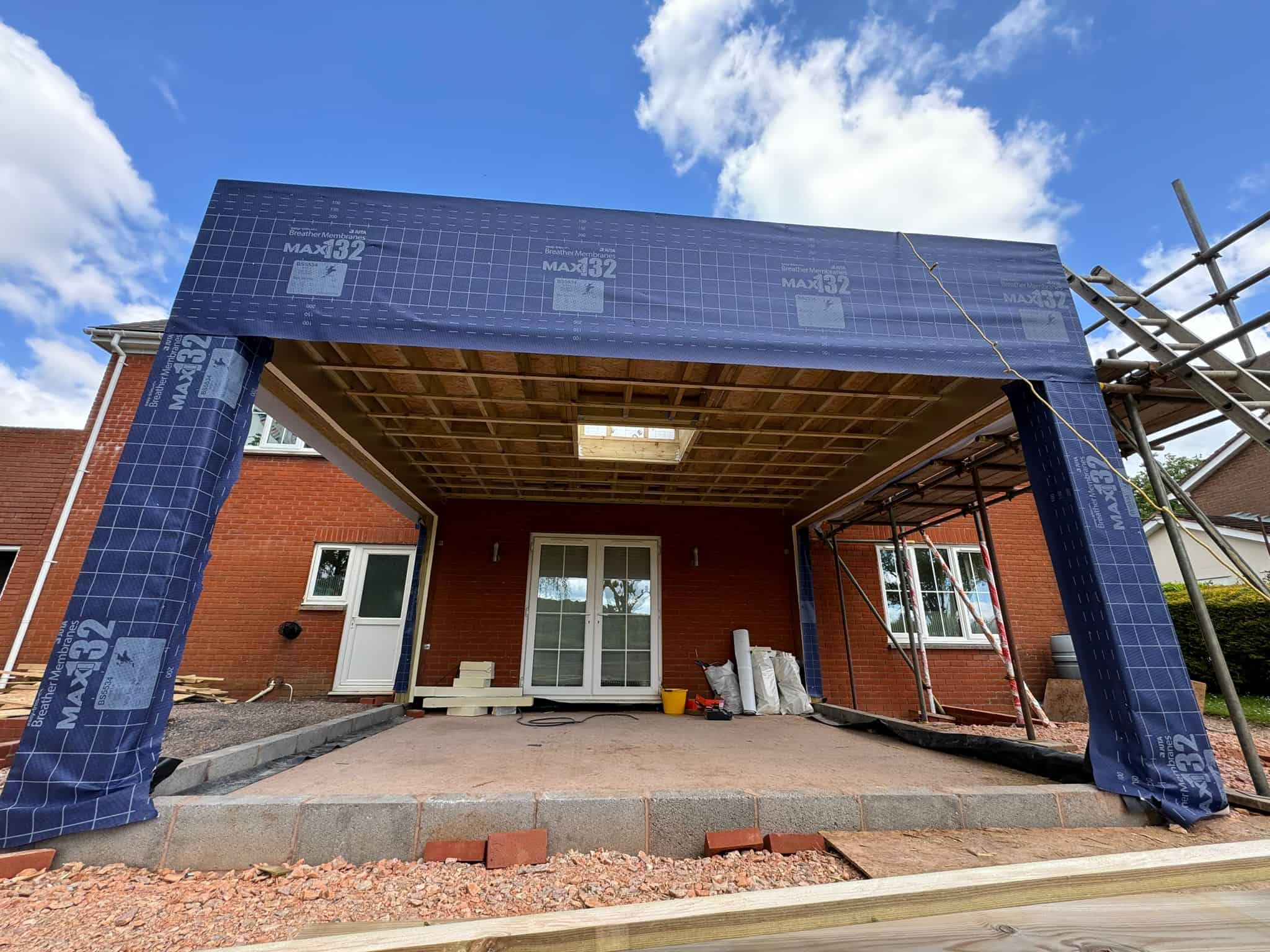 Newly built carport in progress by JB Carpentry & Construction, experts in custom carpentry and renovation services in the UK.