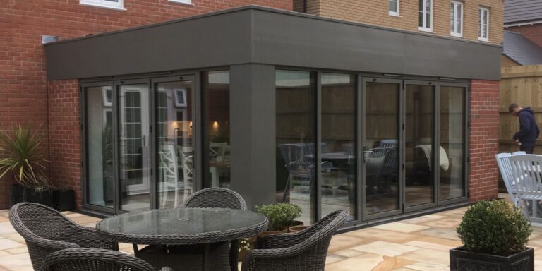 Modern conservatory extension with aluminium framing by JB Carpentry & Construction.